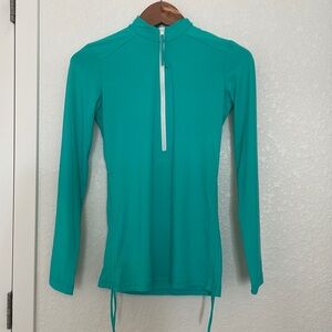 Women’s Teal Rashguard: from Carve Designs in size XS.